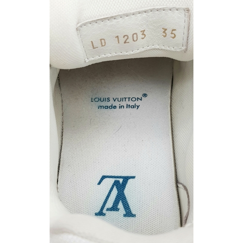 256 - A pair of Louis Vuitton embossed monogram denim sneakers. White leather and monogram denim exterior.... 