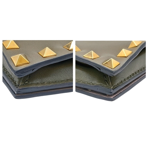 277 - A Valentino Garavani Nappa Rockstud Wristlet Clutch. Olive Green leather exterior with gold-toned st... 