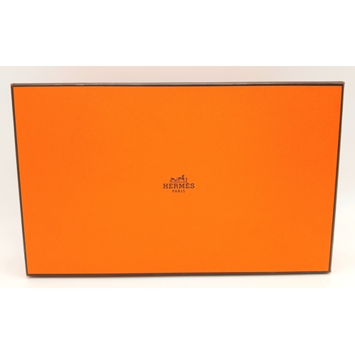 306 - Withdrawn - A Hermès Colourful Silk Animal Print Scarf. In good condition. Approx 90cm x 90cm. Comes... 