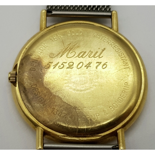 31 - A Georg Jensen 18K Gold Watch. Mesh bracelet. 18k gold case - 35mm. Silver tone dial. Quartz movemen... 