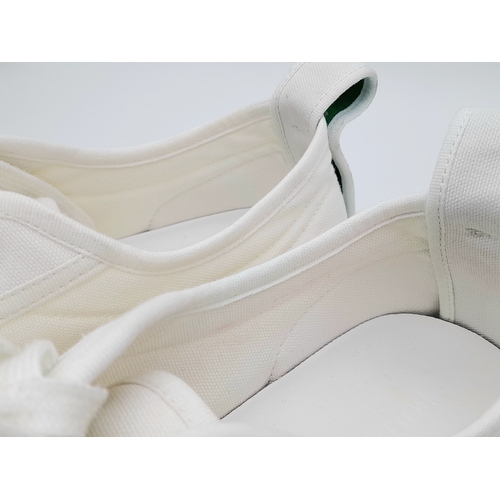328 - A pair of Bottega Veneta Vulcan Canvas Sneakers. Optic white canvas upper with tonal stitching, rein... 