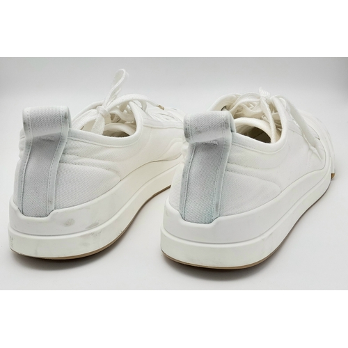 328 - A pair of Bottega Veneta Vulcan Canvas Sneakers. Optic white canvas upper with tonal stitching, rein... 