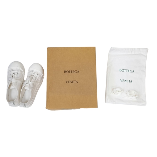 328 - A pair of Bottega Veneta Vulcan Canvas Sneakers. Optic white canvas upper with tonal stitching, rein... 
