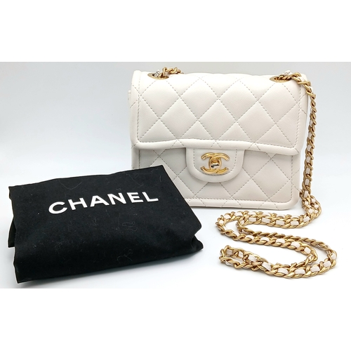505 - A Chanel Caviar Quilted Classic Flap Bag. White diamond-quilted caviar leather with gold-toned hardw... 