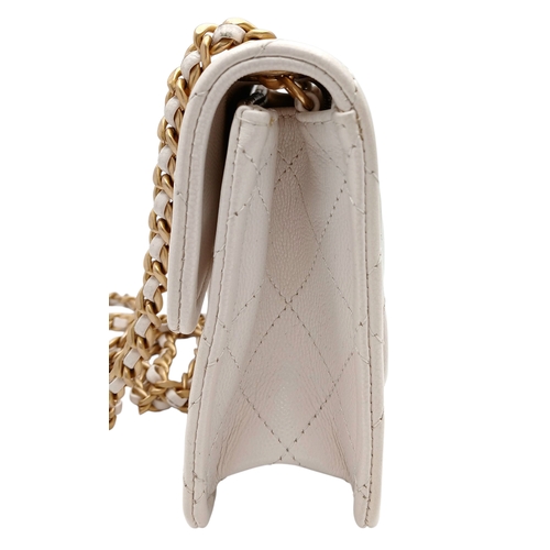 505 - A Chanel Caviar Quilted Classic Flap Bag. White diamond-quilted caviar leather with gold-toned hardw... 