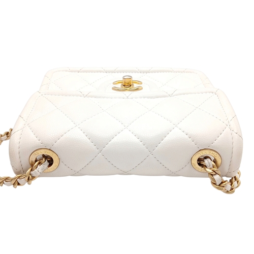 505 - A Chanel Caviar Quilted Classic Flap Bag. White diamond-quilted caviar leather with gold-toned hardw... 