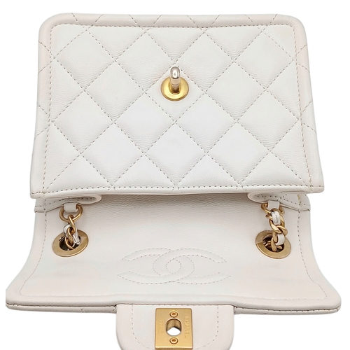 505 - A Chanel Caviar Quilted Classic Flap Bag. White diamond-quilted caviar leather with gold-toned hardw... 