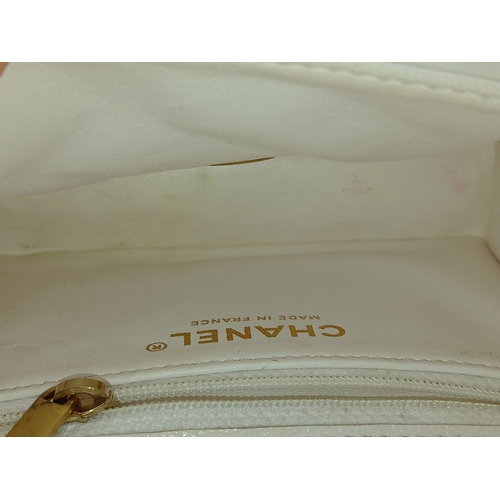 505 - A Chanel Caviar Quilted Classic Flap Bag. White diamond-quilted caviar leather with gold-toned hardw... 