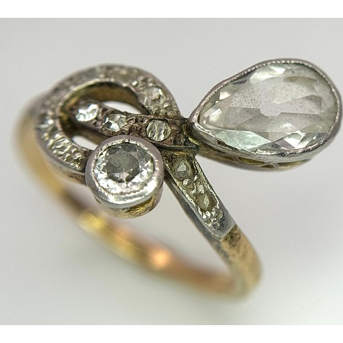 33 - An Antique Edwardian 18K Gold, Platinum and Diamond Ring. Abstract form with Pear and Old Cut Diamon... 