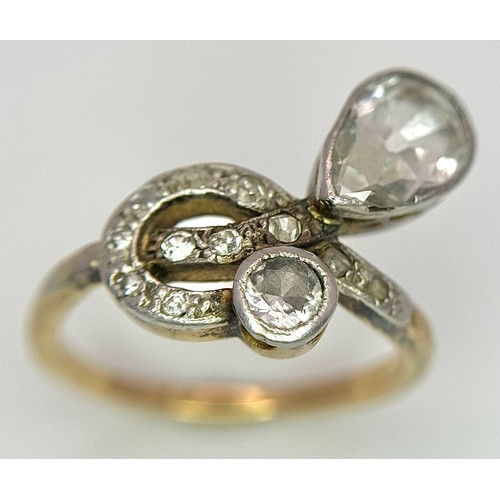 33 - An Antique Edwardian 18K Gold, Platinum and Diamond Ring. Abstract form with Pear and Old Cut Diamon... 