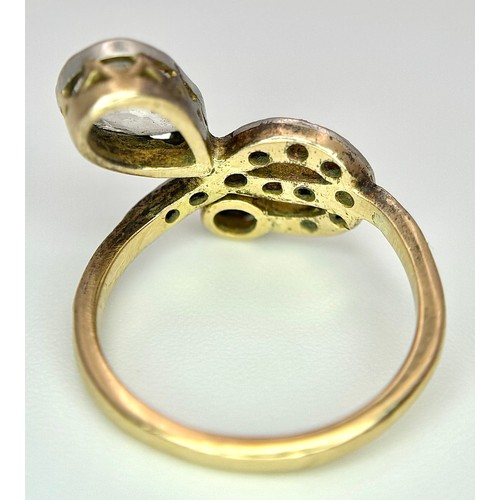 33 - An Antique Edwardian 18K Gold, Platinum and Diamond Ring. Abstract form with Pear and Old Cut Diamon... 