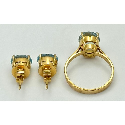 332 - An 18K Yellow Gold, Aquamarine Ring and Earring Set. Ring - 2ct oval cut, size L 1/2. Earrings - 2.5... 