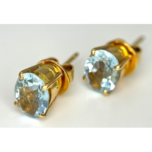 332 - An 18K Yellow Gold, Aquamarine Ring and Earring Set. Ring - 2ct oval cut, size L 1/2. Earrings - 2.5... 