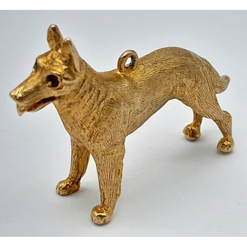 139 - A 9K Yellow Gold German Shepard Dog with Ruby Eyes Pendant/charm. 3cm. 7.2g.