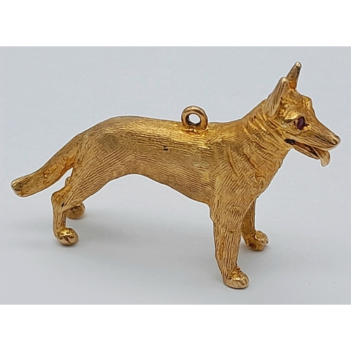 139 - A 9K Yellow Gold German Shepard Dog with Ruby Eyes Pendant/charm. 3cm. 7.2g.