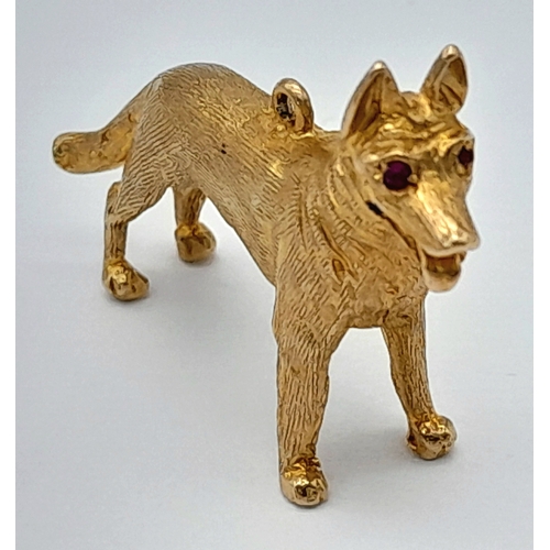 139 - A 9K Yellow Gold German Shepard Dog with Ruby Eyes Pendant/charm. 3cm. 7.2g.