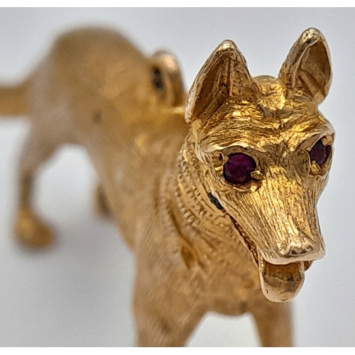 139 - A 9K Yellow Gold German Shepard Dog with Ruby Eyes Pendant/charm. 3cm. 7.2g.