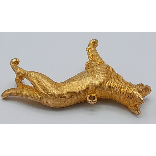 139 - A 9K Yellow Gold German Shepard Dog with Ruby Eyes Pendant/charm. 3cm. 7.2g.