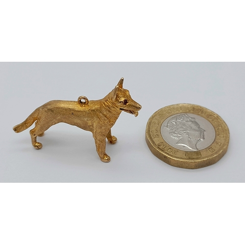 139 - A 9K Yellow Gold German Shepard Dog with Ruby Eyes Pendant/charm. 3cm. 7.2g.