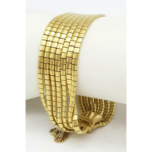 162 - A Beautiful 18K Yellow Gold (tested) Seven Strand Link Bracelet. Clip open design with safety chain.... 