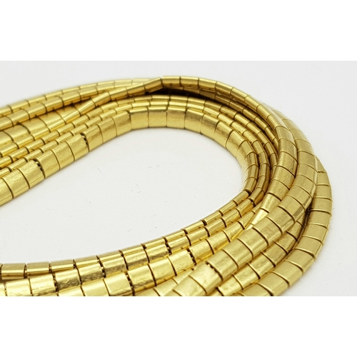 162 - A Beautiful 18K Yellow Gold (tested) Seven Strand Link Bracelet. Clip open design with safety chain.... 