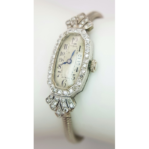 176 - A Vintage, Possibly Art Deco 9K White Gold and Diamond Ladies watch. 9k gold bracelet and elongated ... 