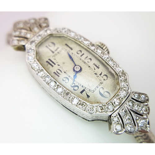 176 - A Vintage, Possibly Art Deco 9K White Gold and Diamond Ladies watch. 9k gold bracelet and elongated ... 