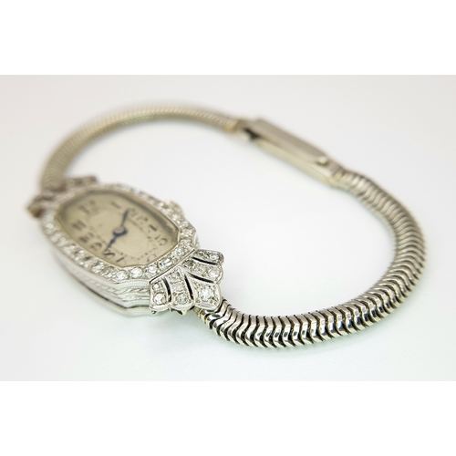 176 - A Vintage, Possibly Art Deco 9K White Gold and Diamond Ladies watch. 9k gold bracelet and elongated ... 
