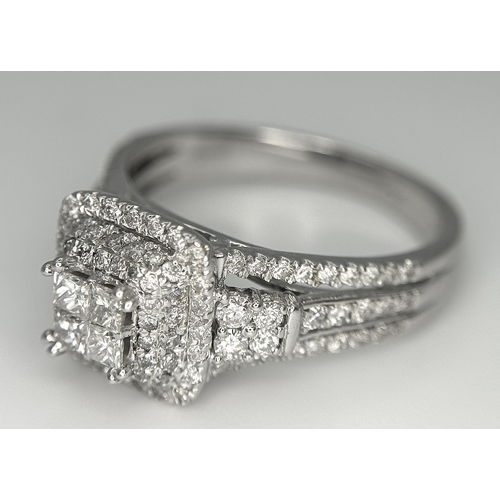166 - A 14K WHITE GOLD DIAMOND TRIPLE HALO RING WITH DIAMOND SET SHOULDERS. MARKED BELLAGIO INSIDE. 0.90CT... 
