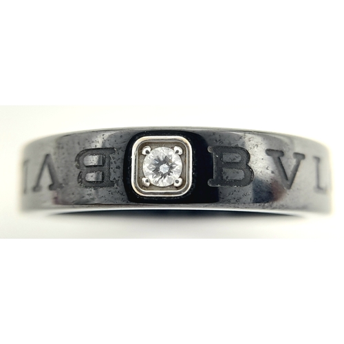 151 - A Bvlgari Ceramic and Diamond Ring. Size R.  Ref: STK018940