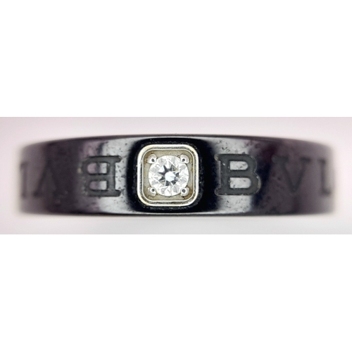151 - A Bvlgari Ceramic and Diamond Ring. Size R.  Ref: STK018940