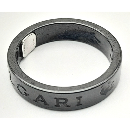 151 - A Bvlgari Ceramic and Diamond Ring. Size R.  Ref: STK018940