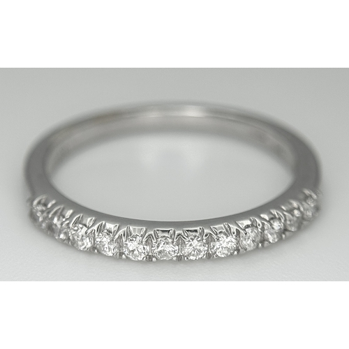 179 - A 9K White Gold Diamond Half Eternity Ring. Size O. 1.9g.  Ref: STK023249