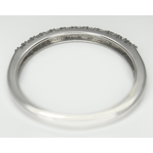 179 - A 9K White Gold Diamond Half Eternity Ring. Size O. 1.9g.  Ref: STK023249