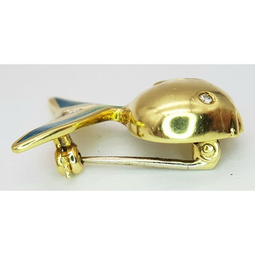 129 - An 18K Yellow Gold and Diamond Fish Brooch. Enamel accents. 22mm. 4.2g.