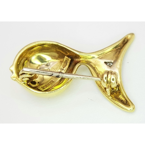 129 - An 18K Yellow Gold and Diamond Fish Brooch. Enamel accents. 22mm. 4.2g.