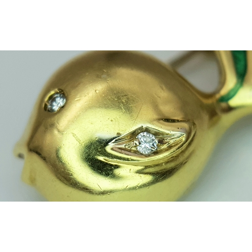 129 - An 18K Yellow Gold and Diamond Fish Brooch. Enamel accents. 22mm. 4.2g.