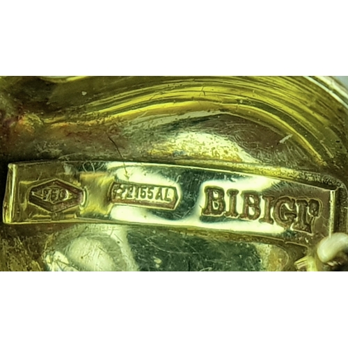 129 - An 18K Yellow Gold and Diamond Fish Brooch. Enamel accents. 22mm. 4.2g.