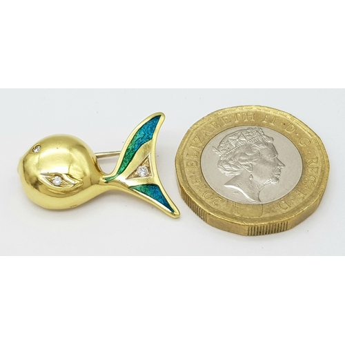 129 - An 18K Yellow Gold and Diamond Fish Brooch. Enamel accents. 22mm. 4.2g.