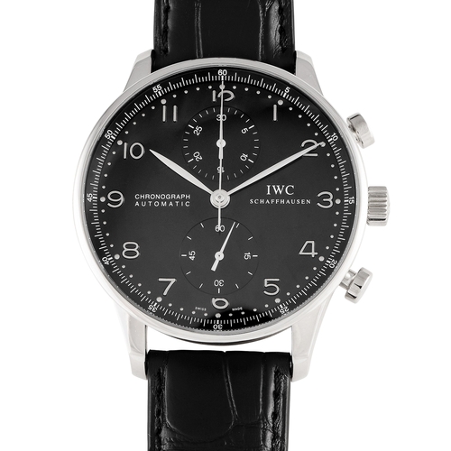 An  18K white gold IWC Portugieser Chronograph Watch. A contemporary icon recognized for its large and legible face. The case measures 40.9mm in diameter and has an almost non-existent bezel similar to the design of the IWC standard chronograph launched in 1998. Silver Arabic numeral hour markers, silver-toned leaf-shaped hands, and two sub-counters at 12 and 6.  caliber 79350 automatic movement with 31 jewels and 44 hours of power reserve. black leather strap with a tang buckle. In excellent condition and accompanied by papers and the manufacturer's box.*This item is held at Cadmore USA Office in Pennsylvania, USA and will be shipped from there*