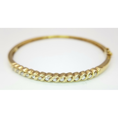 65 - A 9K YELLOW GOLD DIAMOND SET BANGLE 9.1G TOTAL WEIGHT, 0.45CT, 5CM x 6CM. REF: JB 3003