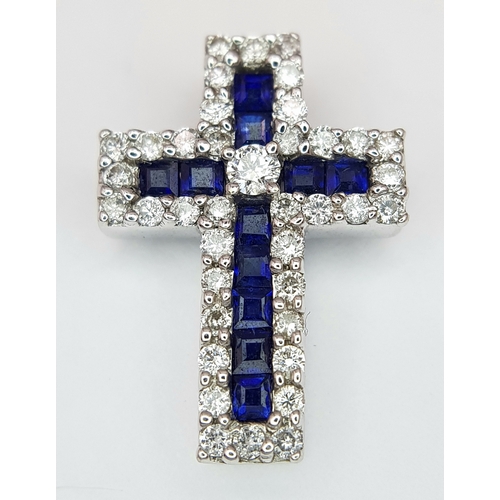 79 - AN 18K WHITE GOLD DIAMOND & SAPPHIRE SET CROSS PENDANT. APPROX 18MM X 13MM. 2.6G TOTAL WEIGHT. REF: ... 
