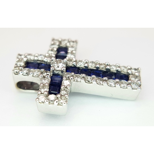 79 - AN 18K WHITE GOLD DIAMOND & SAPPHIRE SET CROSS PENDANT. APPROX 18MM X 13MM. 2.6G TOTAL WEIGHT. REF: ... 