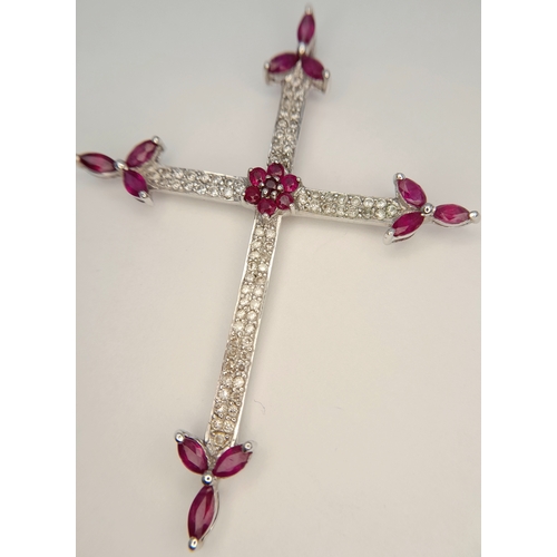 82 - AN 18K WHITE GOLD DIAMOND AND RUBY SET CROSS PENDANT. 4.1G. 6CM. SC-4084.