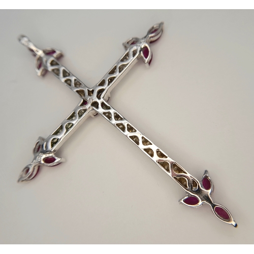 82 - AN 18K WHITE GOLD DIAMOND AND RUBY SET CROSS PENDANT. 4.1G. 6CM. SC-4084.