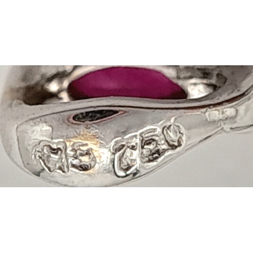 82 - AN 18K WHITE GOLD DIAMOND AND RUBY SET CROSS PENDANT. 4.1G. 6CM. SC-4084.