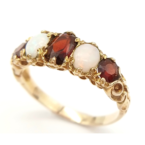 84 - Beautiful vintage 9 CARAT GOLD, OPAL and GARNET RING. Having 2 x FIRE OPALS set to top with 3 x Roun... 