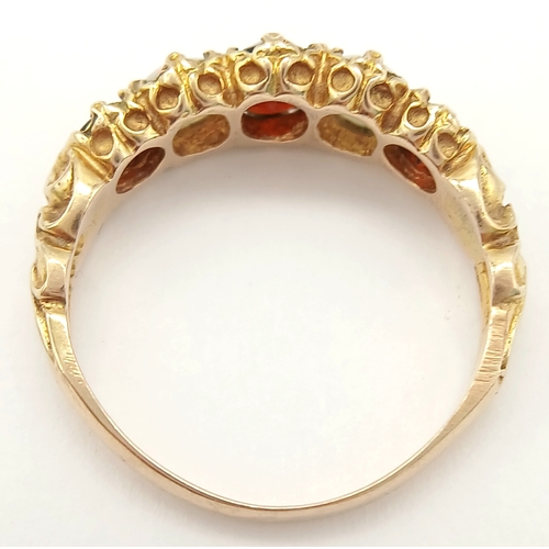 84 - Beautiful vintage 9 CARAT GOLD, OPAL and GARNET RING. Having 2 x FIRE OPALS set to top with 3 x Roun... 