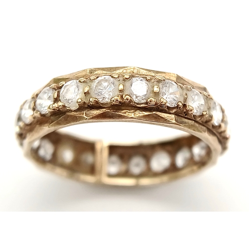 91 - Classic Traditional 9 CARAT GOLD ETERNITY RING. Set with a full circle of sparkling ZIRCONIA GEMSTON... 