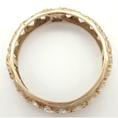 91 - Classic Traditional 9 CARAT GOLD ETERNITY RING. Set with a full circle of sparkling ZIRCONIA GEMSTON... 